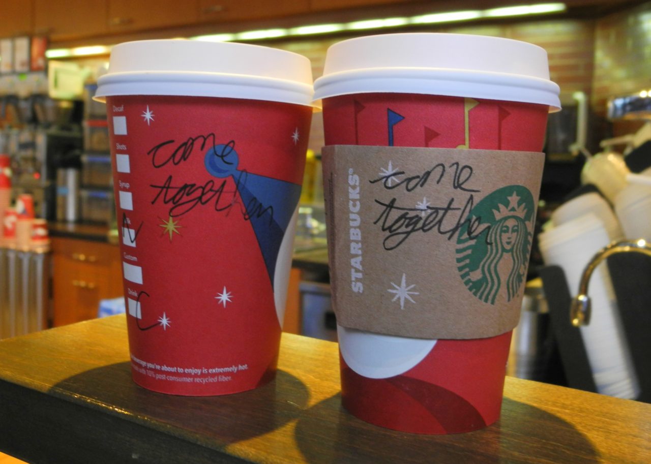 A Starbucks employee writes a message on a cup of freshly brewed coffee at a local store in Washington, DC on December 26, 2012. Starbucks stirred the political pot Wednesday by urging its baristas to write "come together" on its cups as a way to pressure US lawmakers to compromise on a deal to avert a year-end fiscal crisis. Starbucks chief executive Howard Schultz said the American coffee giant was recommending its first-ever message on the side of tall, grande and venti (small, medium and large) drinks sold at its Washington stores as a way to help break the capital's gridlock on the so-called "fiscal cliff." Lawmakers and the White House have less than a week to work out a deal aimed at preventing tax hikes from hitting all Americans and a series of deep, mandated spending cuts from kicking in beginning January 1. AFP PHOTO/Eva HAMBACH