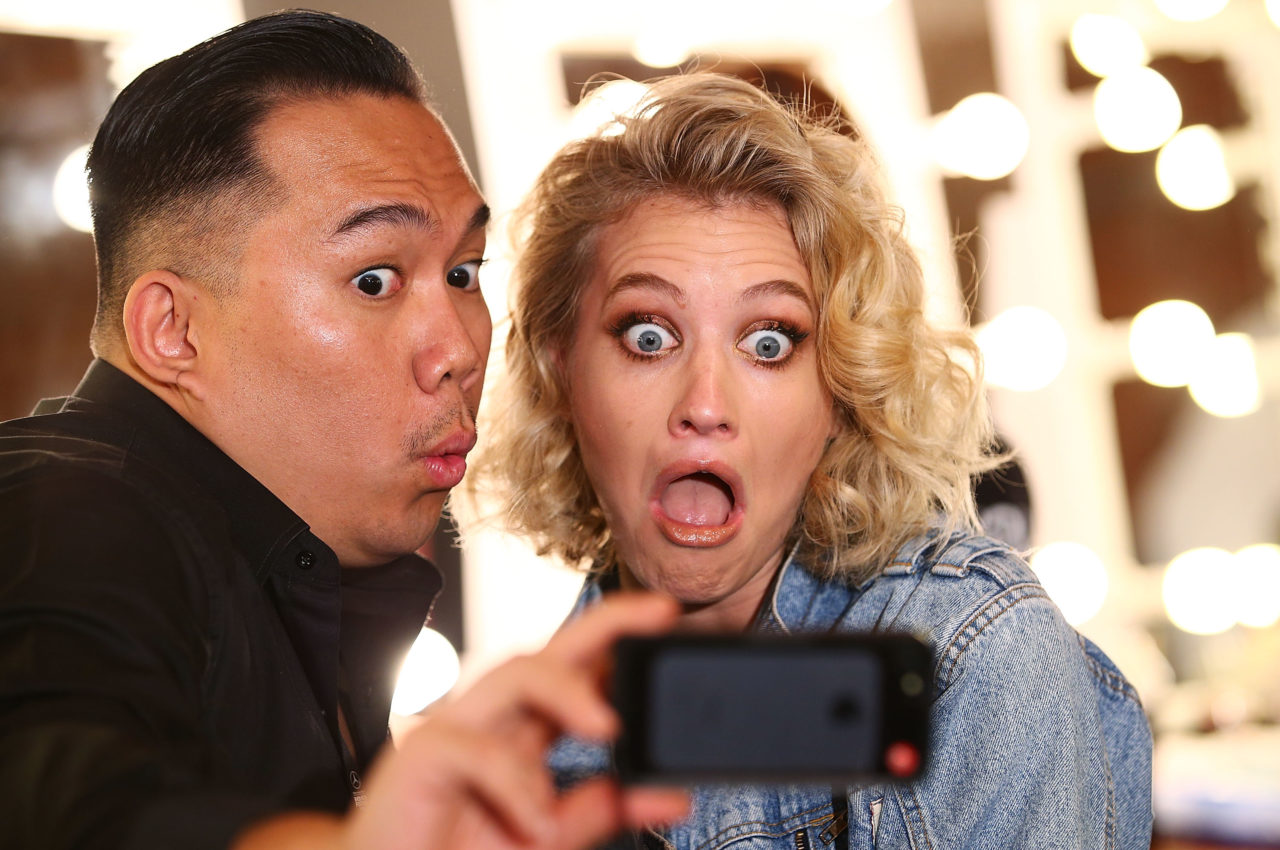 SYDNEY, AUSTRALIA - SEPTEMBER 25: A make up artist and model take a selfie backstage for the Fashion Bloggers on Style: Spring Edits show during Mercedes-Benz Fashion Festival Sydney at Sydney Town Hall on September 25, 2014 in Sydney, Australia.