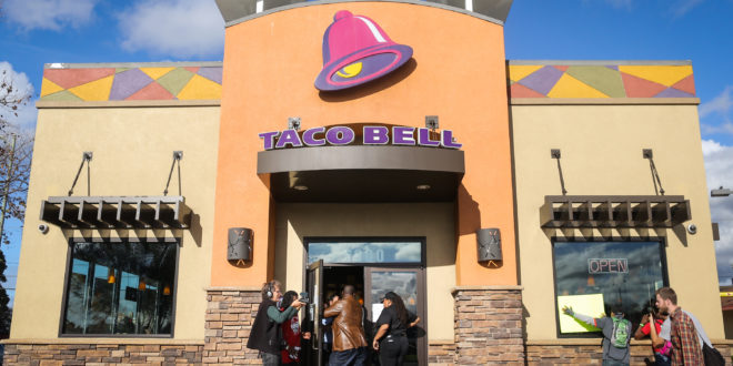 OAKLAND, CA - DECEMBER 4: Protesters enter a Taco Bell as part of a demonstration for higher wages and better security for fast food workers on December 4, 2014 in Oakland, California. The Taco Bell has been the victim of numerous violent robberies but has no security guard. The protest was part of a nationwide day of demonstrations.