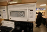 CHICAGO - JANUARY 22: A microwave oven made by General Electric Co. (GE) is offered for sale alongside other appliances at a Sears store January 22, 2010 in Chicago, Illinois. Today GE posted a 19% slump in fourth-quarter earnings, but still beat Wall Street expectations.