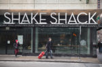 CHICAGO, IL - JANUARY 28: A sign hangs over the entrance of a Shake Shack restaurant on January 28, 2015 in Chicago, Illinois. The burger chain, with currently has 63 locations, is expected to go public this week with an IPO priced between $17 to $19 a share. The company will trade on the New York Stock Exchange under the ticker symbol SHAK. (Photo by Scott Olson/Getty Images)