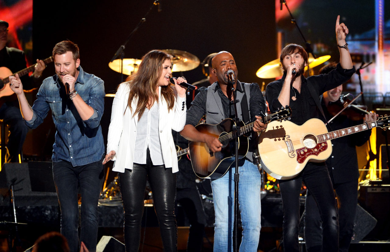 LAS VEGAS, NV - APRIL 06: Recording artists Charles Kelley (L), Hillary Scott (2nd L) and Dave Haywood (R) of Lady Antebellum perform onstage with recording artist Darius Rucker (2nd R) duringg the 49th Annual Academy of Country Music Awards at the MGM Grand Garden Arena on April 6, 2014 in Las Vegas, Nevada.