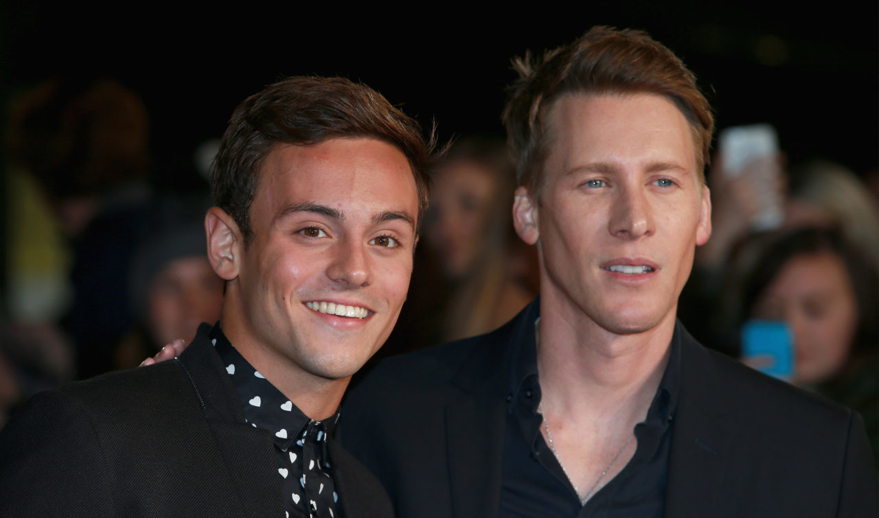 LONDON, ENGLAND - NOVEMBER 05: Tom Daley and Dustin Lance Black attend "The Hunger Games: Mockingjay Part 2" UK Premiere at the Odeon Leicester Square on November 5, 2015 in London, England.