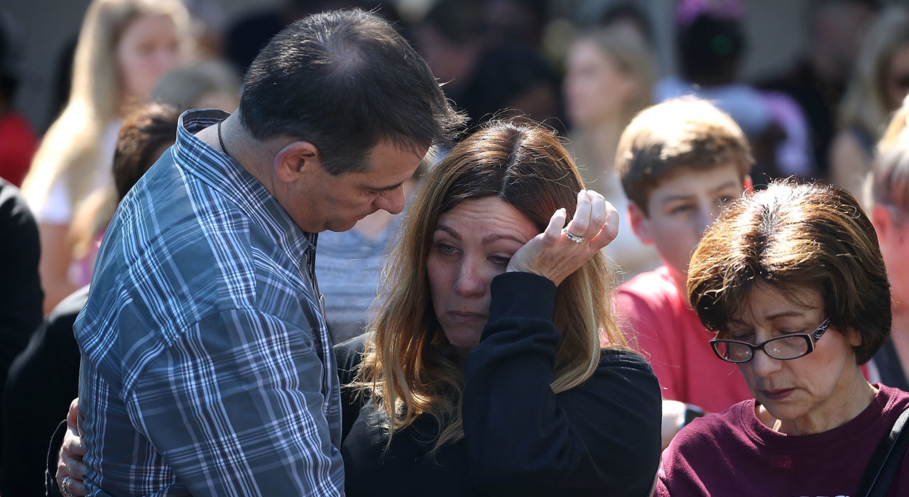 PARKLAND, FL - FEBRUARY 15: People participate in a prayer vigil for famlies of Marjory Stoneman Douglas High School, where a mass shooting took place, at the Parkridge Church, on February 15, 2018 in Parkland, Florida. Yesterday Police arrested 19 year old former student Nikolas Cruz for killing 17 people at the high school.