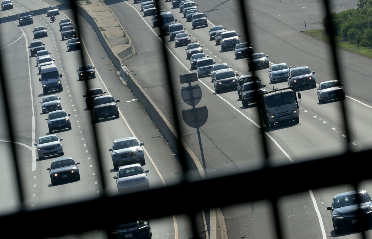FORT WASHINGTON, MD - JULY 03: Automobile traffic moves along the Capitol Beltway during rush hour one day before the 4th of July holiday July 3, 2018 in Fort Washington, Maryland. The American Automobile Association (AAA) is predicting that 39.7 million Americans will drive 50 miles or more away from their homes during the Independence Day holiday week, a 5 percent increase over last year. (Photo by Chip Somodevilla/Getty Images)