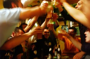 STRASBOURG, FRANCE - MAY 18: Italian students from the Primo Levi Technical Institute of Vignola in the Modena Province, toast with glasses of beer in a pub during a school trip to Strasbourg, France to visit the European Parliament on May 18, 2004. School trips can be a sort of initiation trip for teenagers, where they are introduced for the first time to alcohol and drugs. Many times they don't sleep for the whole trip. The trips often allow the students to get to know each other better. If one is considered "different" than the group, it can be a nightmare experience for the teenager. Mainly the teenagers are only interested in clubs, shopping and having a pizza instead of the cultural aspects of the school trip. (Photo by Marco Di Lauro/Getty Images)