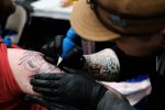 CHATTANOOGA, TENNESSEE - FEBRUARY 01: A client receives a tattoo at the Literary Ink tattoo convention on February 01, 2019 in Chattanooga, Tennessee. The annual convention brings together over 160 tattoo artists from around the world in what is billed as a convention that is the "intersection of literary fantasy and artistic magic." (Photo by Spencer Platt/Getty Images)